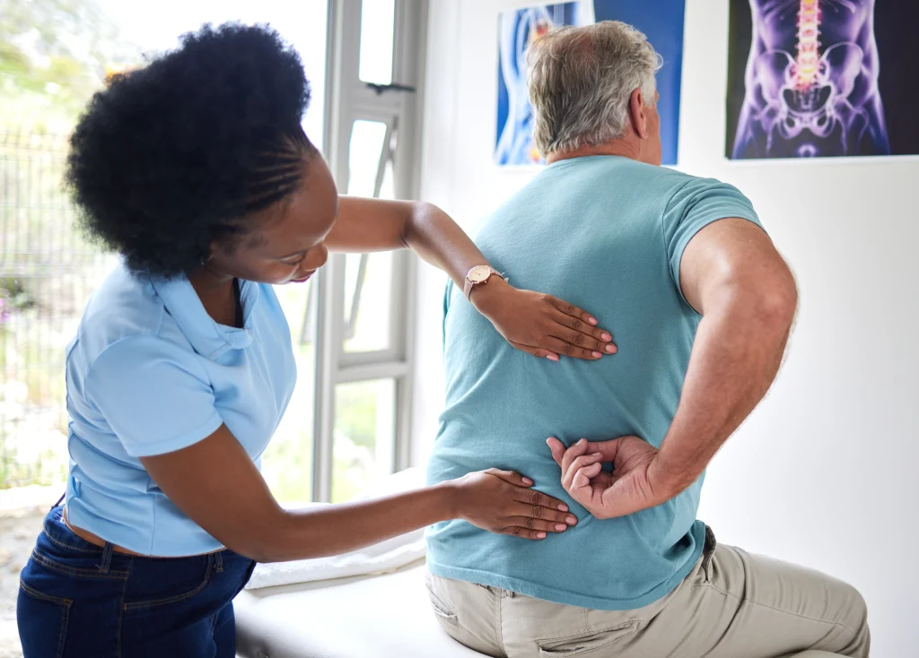 adult man with back pain due to sciatica and nerve-related leg pain. Chiropractic care